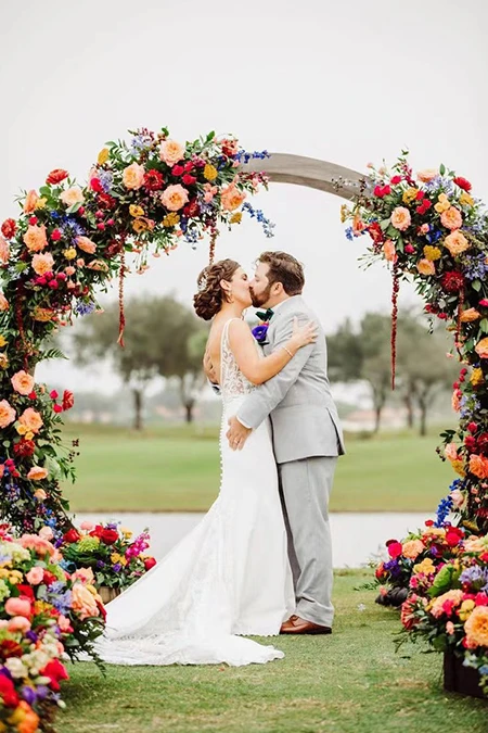 garden outdoor ceremony wedding arch floral decor